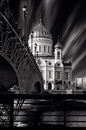 A view of the Cathedral of Christ the Saviour through a fragment of the Crystal Bridge on Moscow River